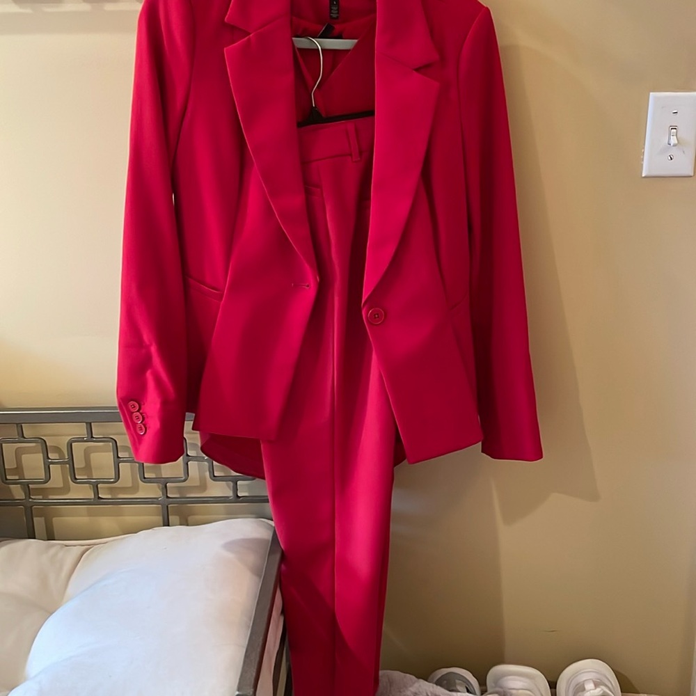 Red pants suit from White House black market. .
